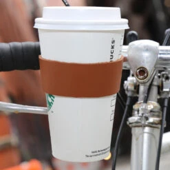 KIKKERLAND Leather Bike Cup Holder -Kikkerland Leather Bike Cup Holder in use