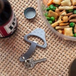 KIKKERLAND Mushroom Keychain Bottle Opener -Kikkerland mushroom keychain bottle opener on table