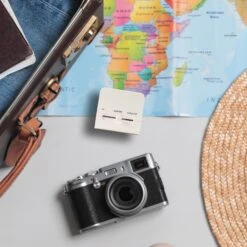 KIKKERLAND Travel Adaptor -Kikkerland travel adaptor on table